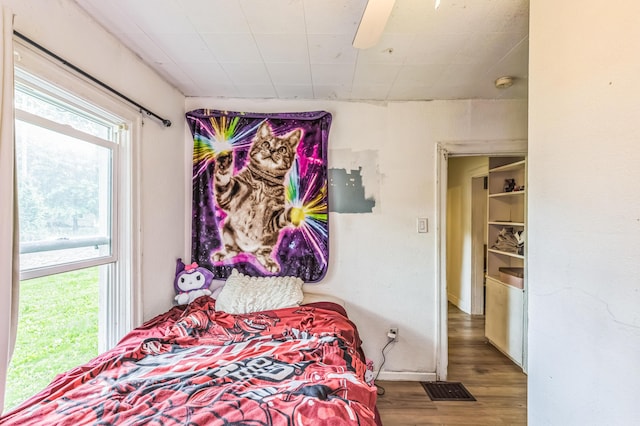 bedroom featuring wood finished floors and ceiling fan