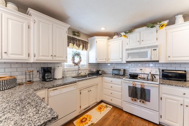 522 E Grace St, Republic, MO 65738 - kitchen featuring white appliances, a sink, light wood finished floors, tasteful backsplash, and recessed lighting