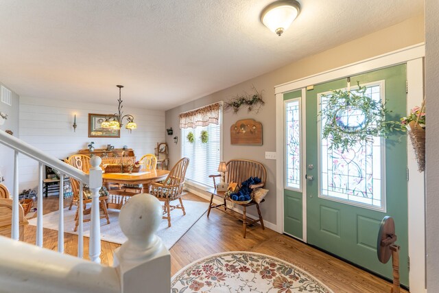 522 E Grace St, Republic, MO 65738 - foyer entrance featuring light wood-style flooring, a chandelier, and baseboards