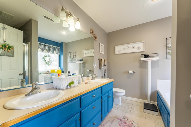 522 E Grace St, Republic, MO 65738 - full bathroom featuring tile patterned flooring, a bath, toilet, double vanity, and baseboards