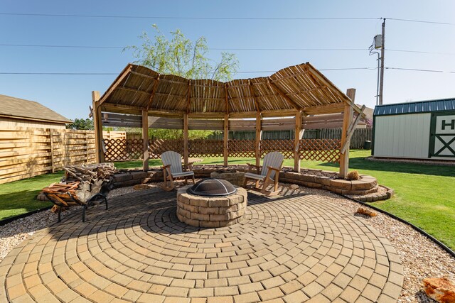 522 E Grace St, Republic, MO 65738 - view of patio featuring an outdoor fire pit, an outdoor structure, and a shed