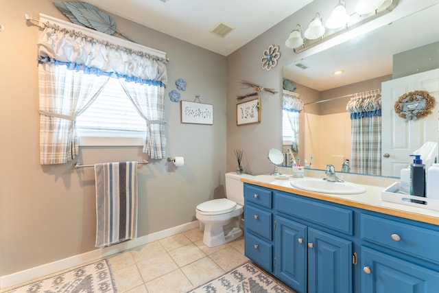 522 E Grace St, Republic, MO 65738 - full bath featuring tile patterned flooring, toilet, a shower with curtain, baseboards, and vanity