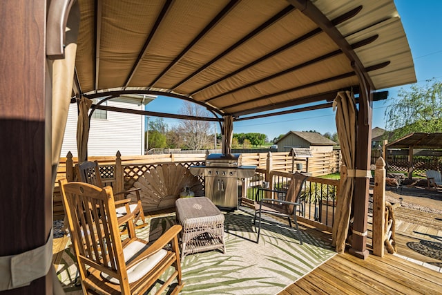 522 E Grace St, Republic, MO 65738 - wooden deck with area for grilling and fence