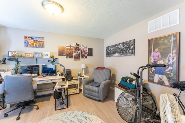 522 E Grace St, Republic, MO 65738 - office area with wood finished floors and a textured ceiling
