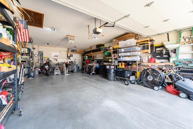 522 E Grace St, Republic, MO 65738 - garage featuring a garage door opener