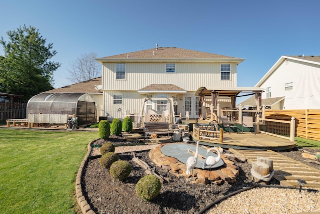 522 E Grace St, Republic, MO 65738 - back of property with a greenhouse, a shingled roof, a wooden deck, and an outdoor structure