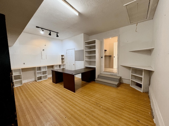 707 S Eastridge, Nixa, MO 65714 - unfurnished office with attic access, wood finished floors, a textured ceiling, track lighting, and baseboards