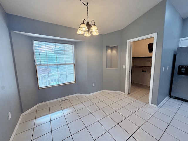 707 S Eastridge, Nixa, MO 65714 - spare room featuring a chandelier, light tile patterned floors, and baseboards