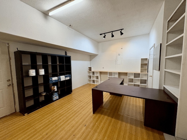 707 S Eastridge, Nixa, MO 65714 - unfurnished office featuring wood finished floors, track lighting, and a textured ceiling