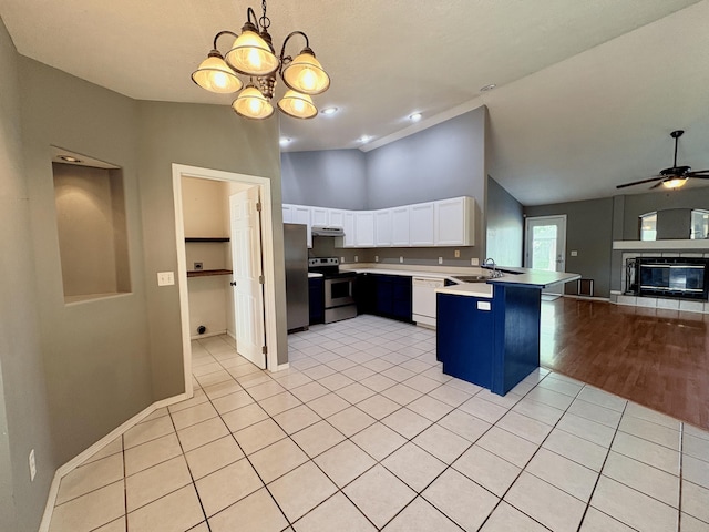 707 S Eastridge, Nixa, MO 65714 - kitchen featuring stainless steel appliances, open floor plan, a peninsula, a sink, and white cabinetry
