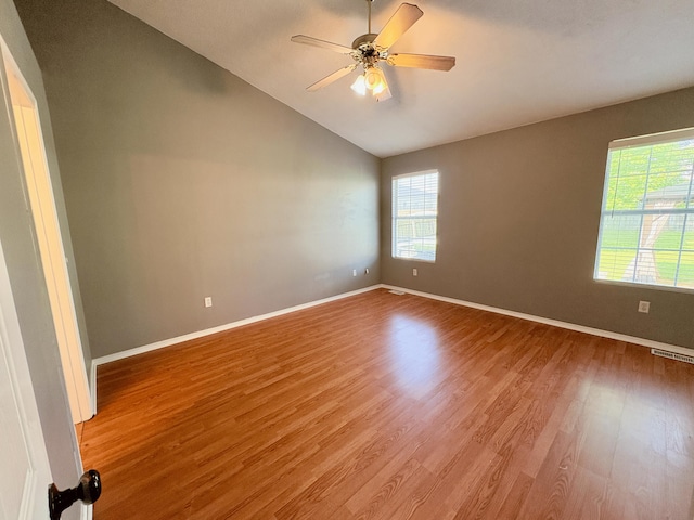 707 S Eastridge, Nixa, MO 65714 - empty room featuring wood finished floors, lofted ceiling, baseboards, and ceiling fan