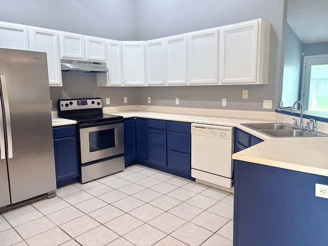 707 S Eastridge, Nixa, MO 65714 - kitchen with stainless steel appliances, a sink, under cabinet range hood, blue cabinetry, and light countertops