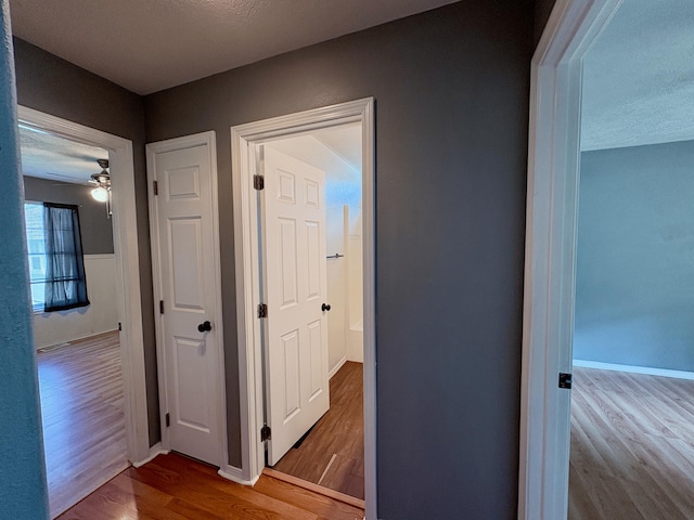 707 S Eastridge, Nixa, MO 65714 - hallway featuring wood finished floors and baseboards