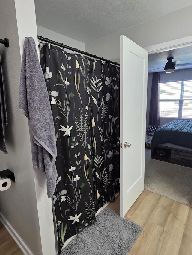 552 S Michelle Ave, Republic, MO 65738 - full bath featuring wood finished floors, connected bathroom, and curtained shower