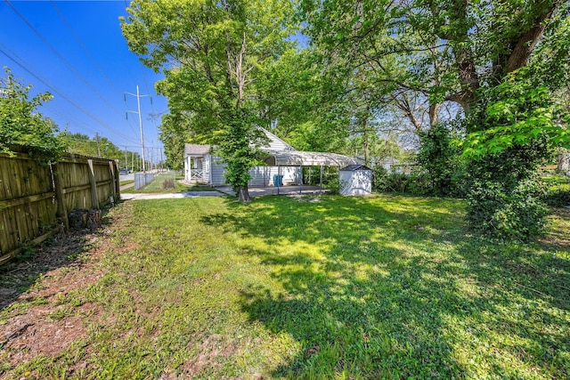 2221 W Nichols St, Springfield, MO 65802 - view of yard featuring an outdoor structure and a carport
