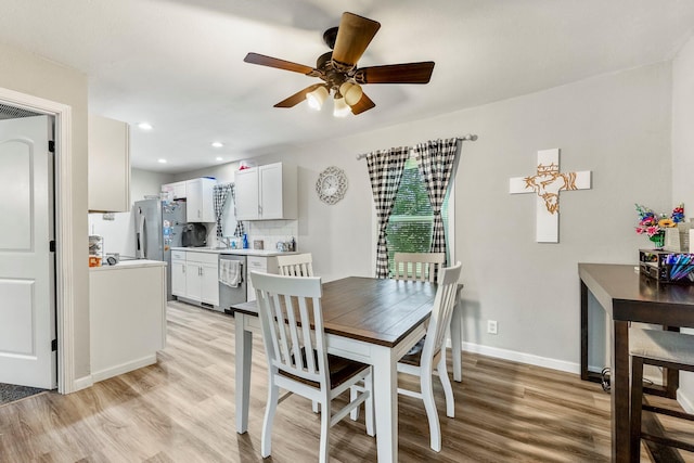 2221 W Nichols St, Springfield, MO 65802 - dining space featuring light wood-type flooring, a ceiling fan, baseboards, and recessed lighting