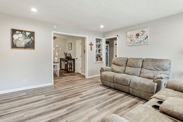 2221 W Nichols St, Springfield, MO 65802 - living room featuring light wood-style flooring, baseboards, recessed lighting, and built in features