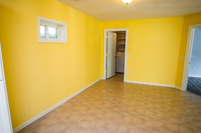358 High Ridge Rd, Marshfield, MO 65706 - unfurnished room featuring washer / clothes dryer, light tile patterned floors, and baseboards