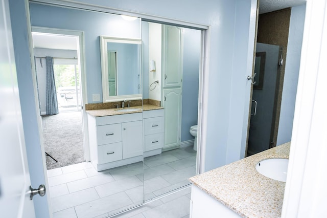 358 High Ridge Rd, Marshfield, MO 65706 - bathroom featuring vanity, toilet, a stall shower, and tile patterned floors