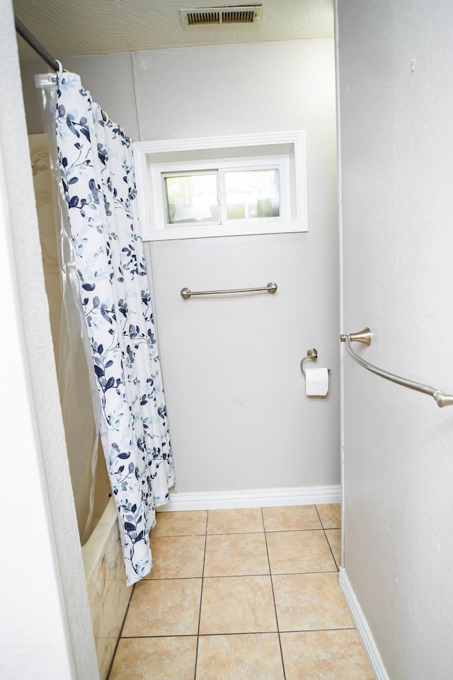 358 High Ridge Rd, Marshfield, MO 65706 - full bathroom featuring tile patterned floors, shower / tub combo with curtain, and baseboards