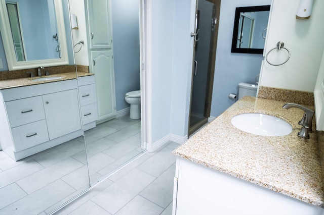 358 High Ridge Rd, Marshfield, MO 65706 - full bathroom with toilet, a shower stall, two vanities, and baseboards