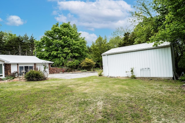 358 High Ridge Rd, Marshfield, MO 65706 - view of green lawn with an outdoor structure and a pole building