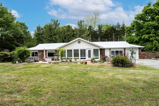 358 High Ridge Rd, Marshfield, MO 65706 - ranch-style house with brick siding, a front lawn, metal roof, and a garage