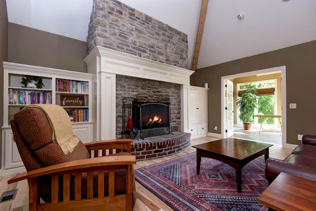 5853 S Northern Ridge Rd, Springfield, MO 65810 - living area with high vaulted ceiling, a fireplace, beam ceiling, and baseboards