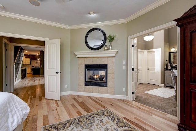 5853 S Northern Ridge Rd, Springfield, MO 65810 - bedroom with a fireplace, light wood-style floors, crown molding, and baseboards