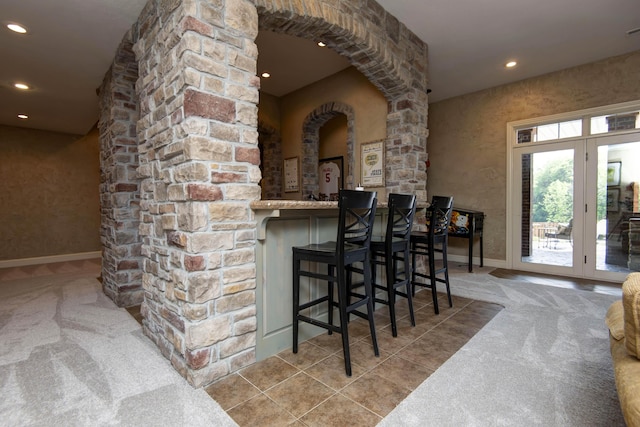 5853 S Northern Ridge Rd, Springfield, MO 65810 - indoor bar with ornate columns, carpet flooring, recessed lighting, arched walkways, and baseboards