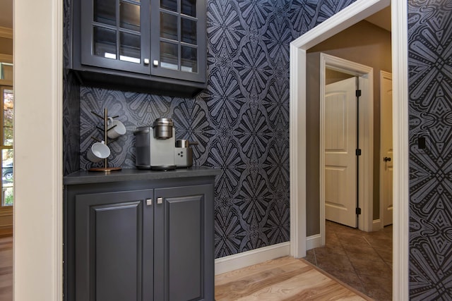 5853 S Northern Ridge Rd, Springfield, MO 65810 - bar with baseboards, tile patterned flooring, and wallpapered walls