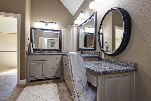 5853 S Northern Ridge Rd, Springfield, MO 65810 - full bathroom featuring vaulted ceiling, a textured wall, tile patterned floors, and vanity