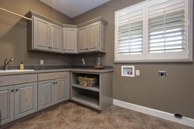 5853 S Northern Ridge Rd, Springfield, MO 65810 - washroom with hookup for an electric dryer, hookup for a washing machine, cabinet space, dark tile patterned floors, and baseboards