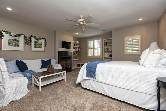 5853 S Northern Ridge Rd, Springfield, MO 65810 - carpeted bedroom featuring a glass covered fireplace, recessed lighting, and ceiling fan