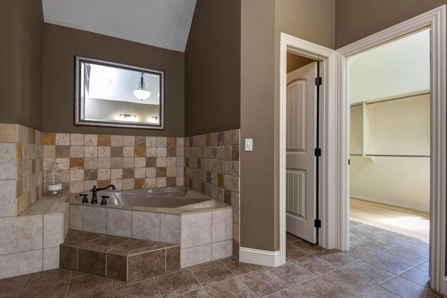 5853 S Northern Ridge Rd, Springfield, MO 65810 - full bath with a bath, a textured wall, tile patterned floors, a spacious closet, and baseboards