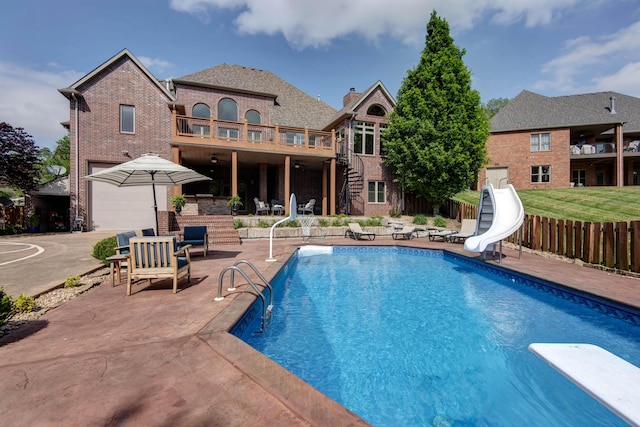 5853 S Northern Ridge Rd, Springfield, MO 65810 - view of pool featuring a water slide, a patio area, stairs, and a diving board