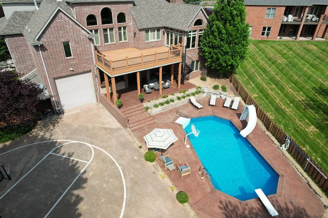 5853 S Northern Ridge Rd, Springfield, MO 65810 - view of pool with a water slide, a patio, and a wooden deck