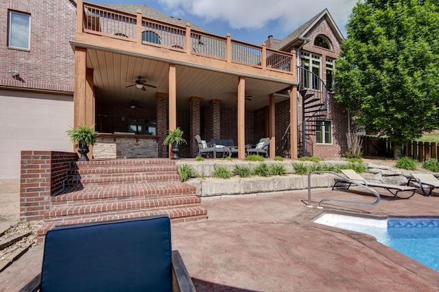 5853 S Northern Ridge Rd, Springfield, MO 65810 - view of patio / terrace with stairway, a ceiling fan, fence, a balcony, and an outdoor pool
