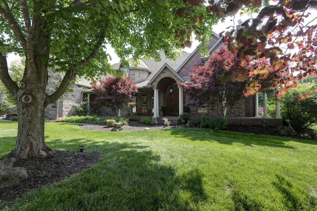 5853 S Northern Ridge Rd, Springfield, MO 65810 - view of front of house featuring stone siding and a front lawn