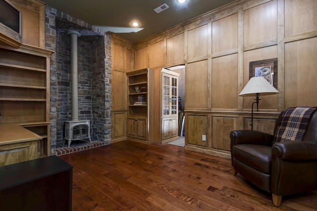 5853 S Northern Ridge Rd, Springfield, MO 65810 - living area featuring a wood stove, dark wood-type flooring, built in features, and recessed lighting
