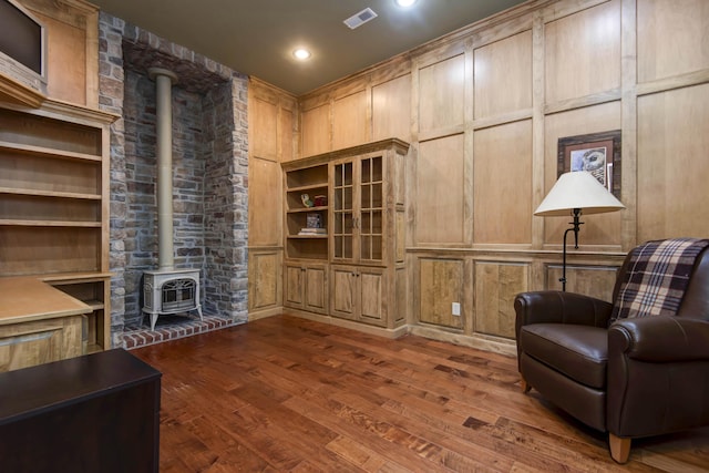 5853 S Northern Ridge Rd, Springfield, MO 65810 - living area featuring a wood stove, dark wood-type flooring, recessed lighting, and heating unit