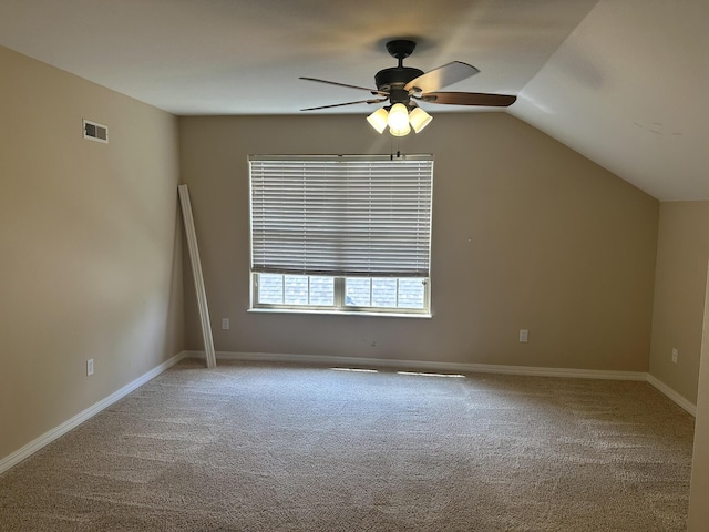 bonus room with a ceiling fan, carpet floors, lofted ceiling, and baseboards