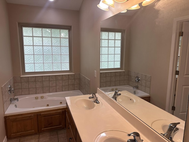 full bath with healthy amount of natural light, a jetted tub, and tile patterned floors