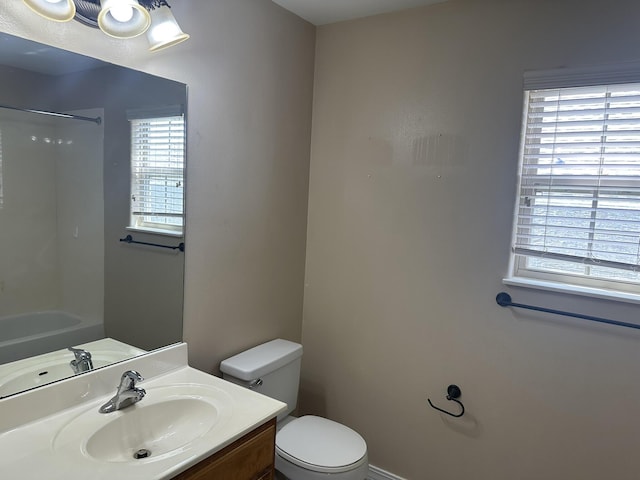 full bath with toilet, plenty of natural light, vanity, and a shower