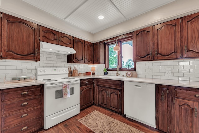 340 Greene Rd, Sparta, MO 65753 - kitchen with white appliances, under cabinet range hood, a sink, light countertops, and backsplash