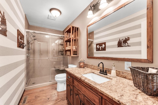340 Greene Rd, Sparta, MO 65753 - full bath featuring toilet, a stall shower, wood finished floors, and vanity