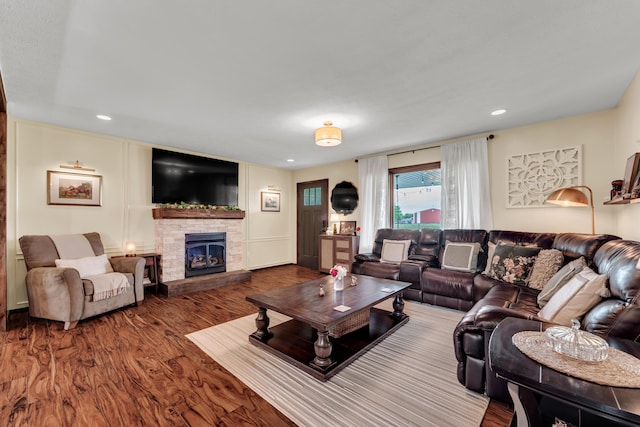 340 Greene Rd, Sparta, MO 65753 - living room featuring wood finished floors, a stone fireplace, and recessed lighting
