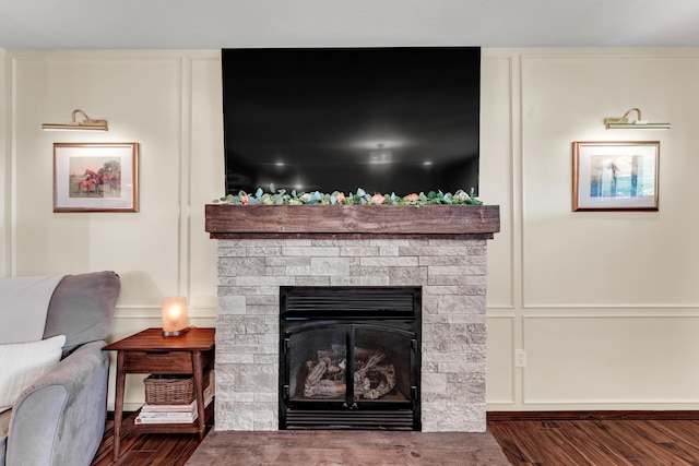 340 Greene Rd, Sparta, MO 65753 - detailed view of wood finished floors, a fireplace, and a decorative wall
