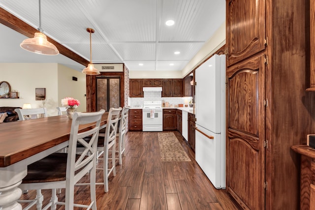 340 Greene Rd, Sparta, MO 65753 - kitchen featuring white appliances, dark wood-style flooring, recessed lighting, light countertops, and tasteful backsplash