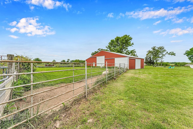 340 Greene Rd, Sparta, MO 65753 - view of yard with a pole building, dirt driveway, a garage, an outbuilding, and a view of countryside